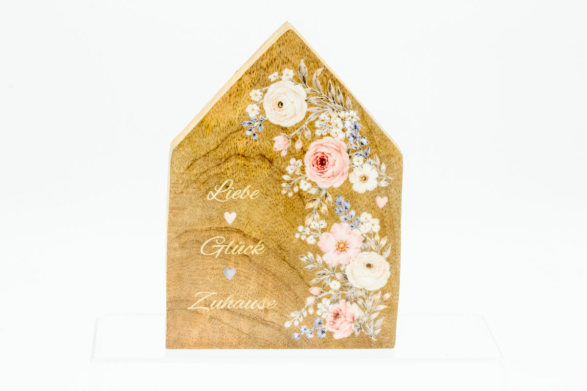 Haus aus Holz mit floralem Rub-on